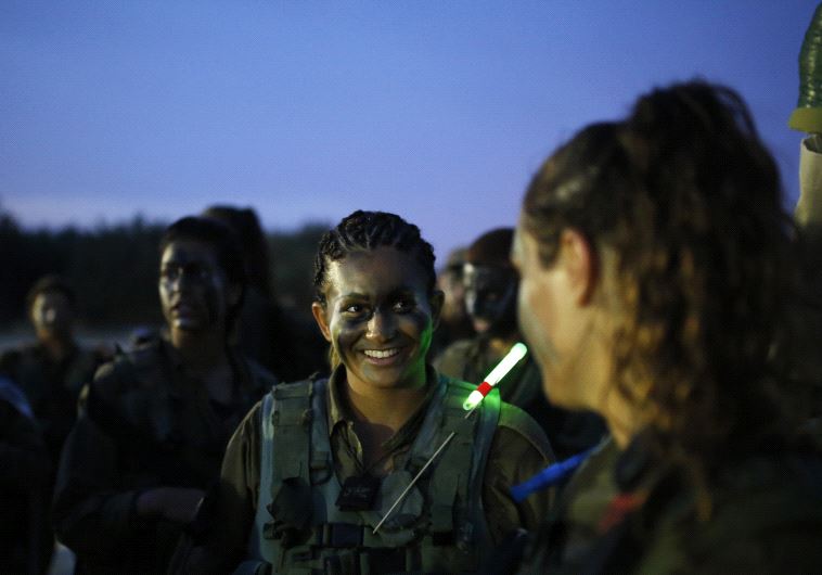 Israeli soldiers of the Caracal battalion take part in a march May 29, 2014.