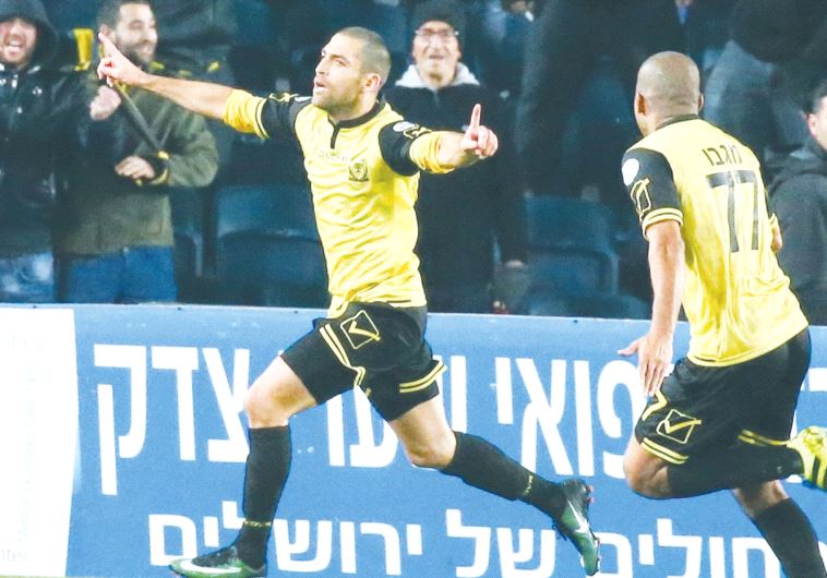Beitar Jerusalem striker Itay Shechter (right) celebrates after scoring the winner in last night’s 1