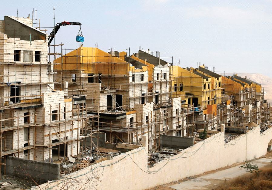 BULIDINGS ARE SEEN last month under construction in the settlement of Ma