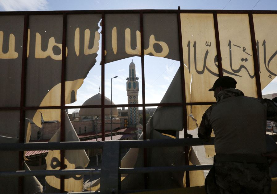 Iraqi Special Operations Forces (ISOF) gather during an operation to clear the al-Zirai district of 