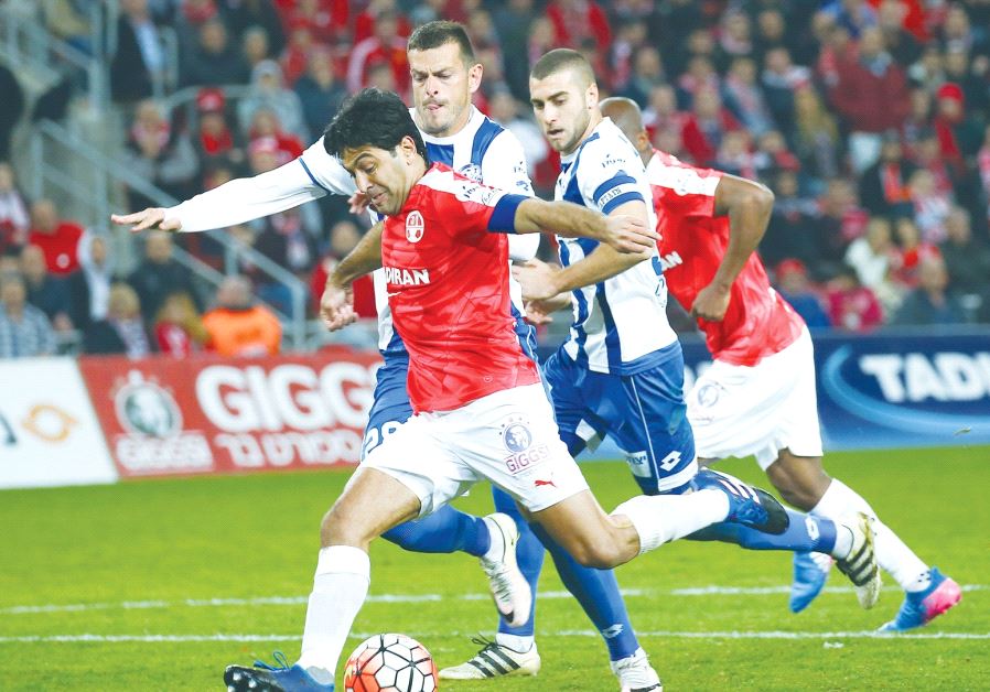 Hapoel Beersheba striker Elyaniv Barda (center) broke his long goal drought with this shot during la