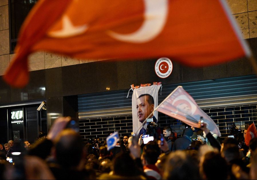 Demonstrators gather ahead of clashes with riot police outside the Turkish consulate in Rotterdam, N