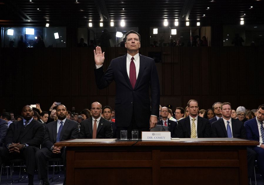 Former FBI Director James Comey is sworn in prior to testifying before a Senate Intelligence Committ