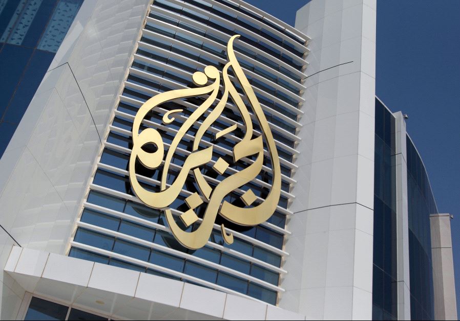 The logo of Al Jazeera Media Network is seen on its headquarters building in Doha, Qatar June 8, 201