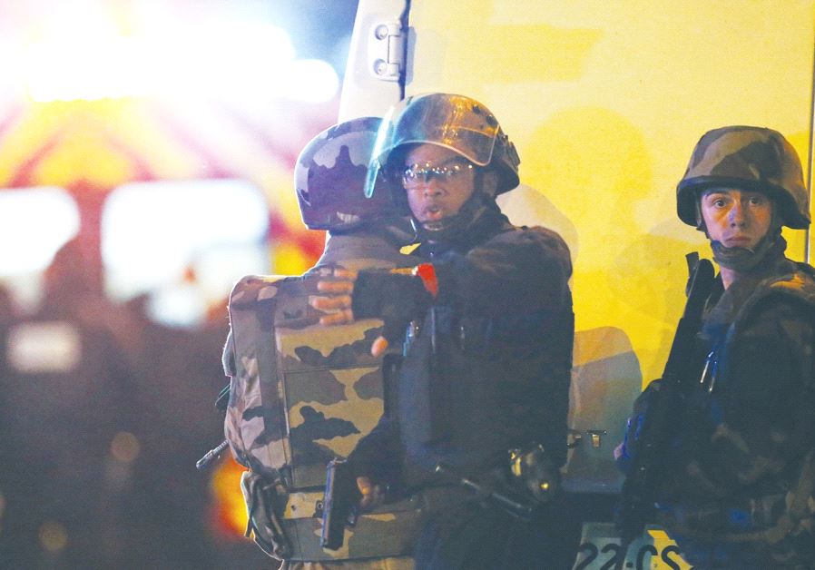 French police are seen outside the Bataclan concert hall where terrorists killed 89 people in Novemb
