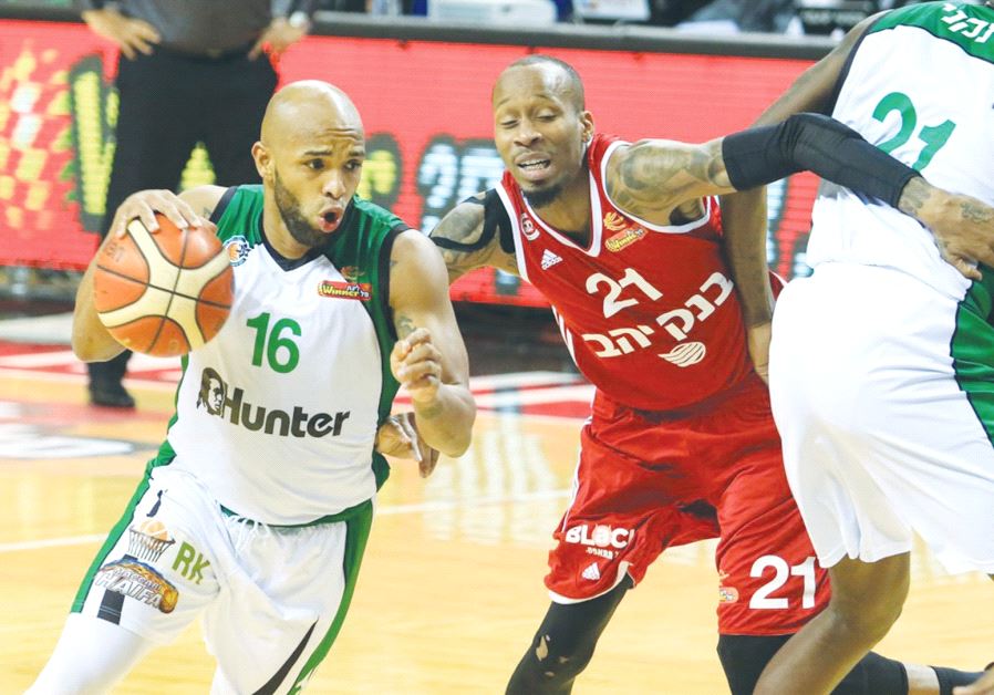 Maccabi Haifa guard Gregory Vargas (left) drives past Hapoel Jerusalem’s Tarence Kinsey during last