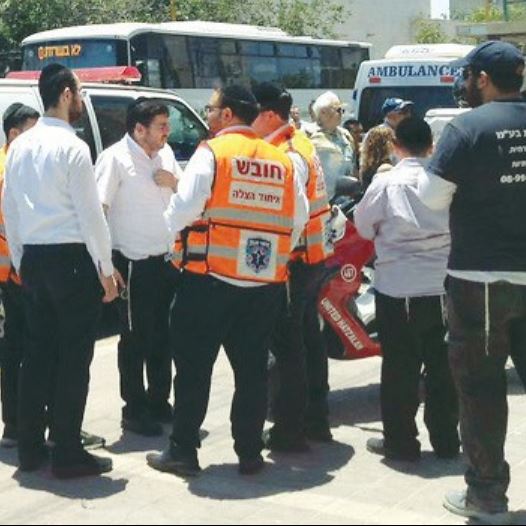 AMBULANCE STAFF in Ashdod attend the scene on May 30 where an infant left in a car died.