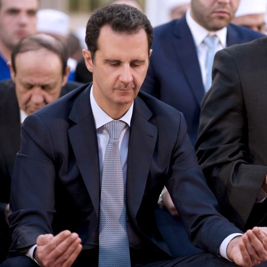 Syria's President Bashar Assad attends prayers on the first day of Eid al-Adha in Damascus