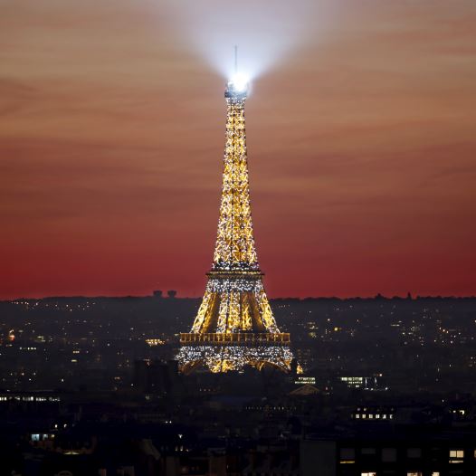 The Eiffel Tower is seen at sunset in Paris