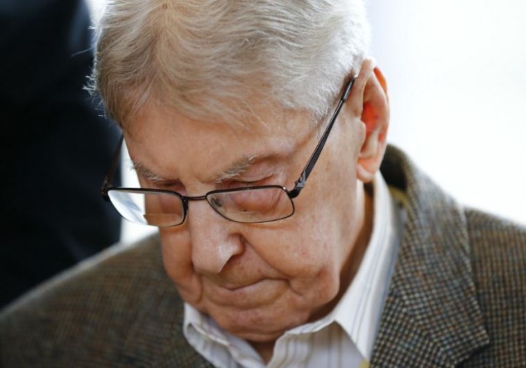 Former Auschwitz guard Reinhold Hanning arrives for his trial at the court in Detmold