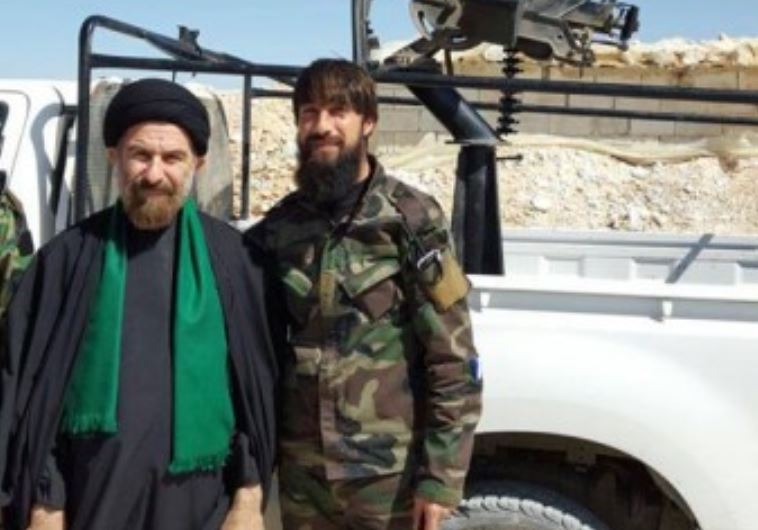 Ali Ghafari (left) next to Iranian fighter