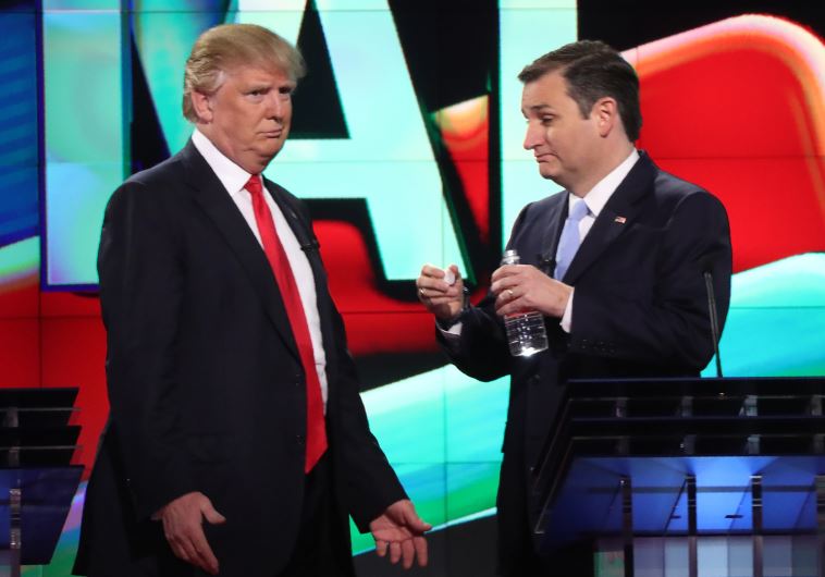 Republican US presidential candidate Donald Trump (L) talks with rival Ted Cruz during a commercial 