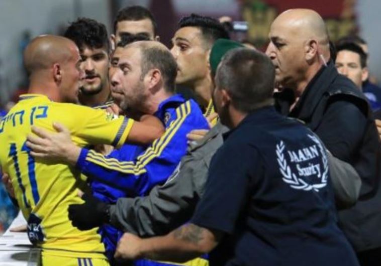 Maccabi Tel Aviv players and security staff engage in fisticuffs at Doha Stadium in Sakhnin