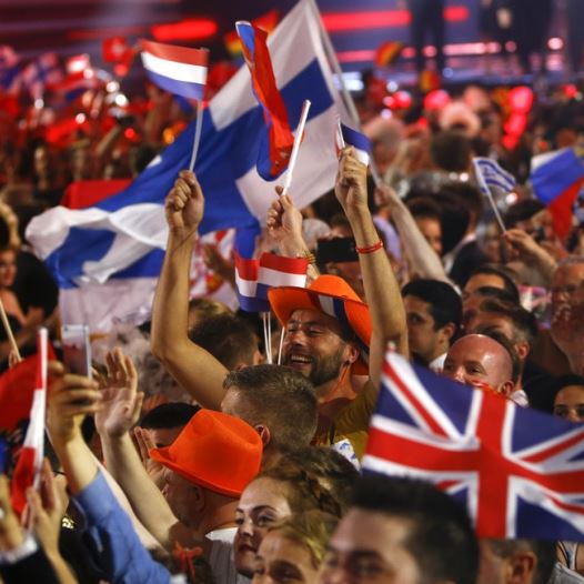 Fans wave flags during the Eurovision song contest in Vienna, May 19, 2015