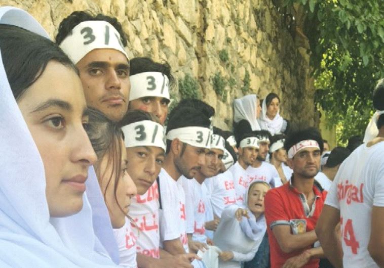 YAZIDI YOUTH demonstrate recently for the recognition of genocide by ISIS at the Lalish Temple in no