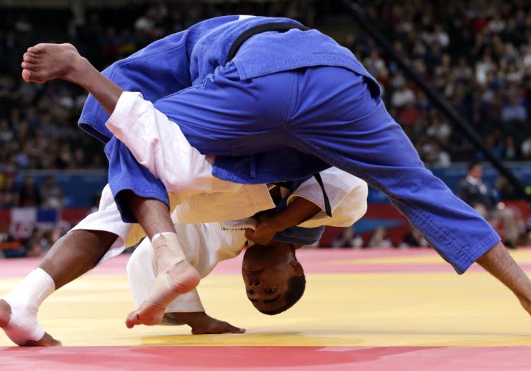 France's David Larose fights with Israel's Golan Pollack (blue) during their men's -66kg elimination