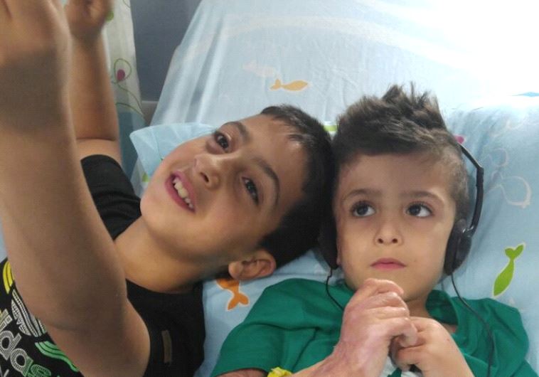 Ahmad Dawabsha at Shebaa Hospital with cousin