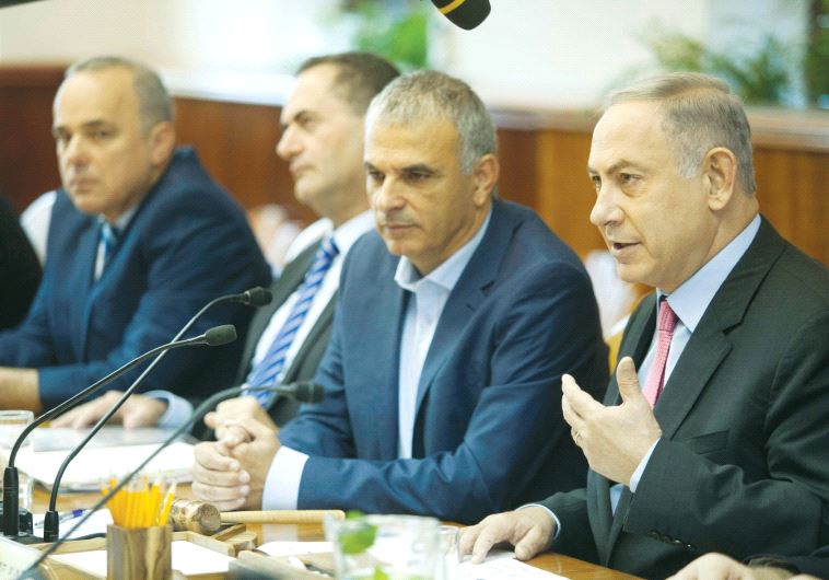 PRIME MINISTER Benjamin Netanyahu praises the new budget before the cabinet debate yesterday.