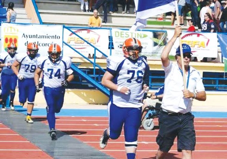 AMERICAN FOOTBALL IN ISRAEL president Steve Leibowitz leads the national tackle football team onto t