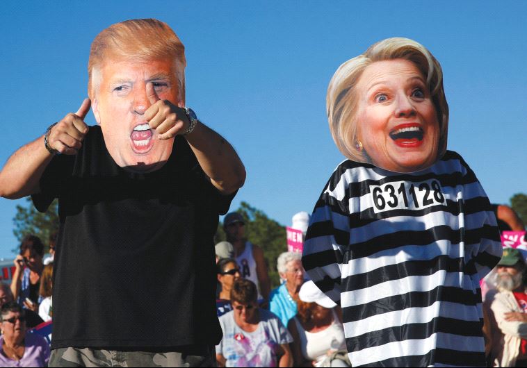PEOPLE DRESS UP as US presidential nominees Donald Trump and Hillary Clinton at a Trump campaign ral