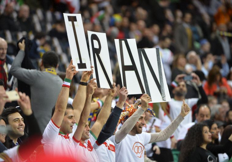 Iran's fans cheer for their team