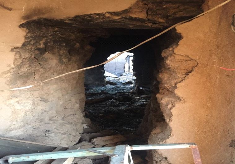 A tunnel in Wardak between buildings blasted by ISIS to conceal movement.