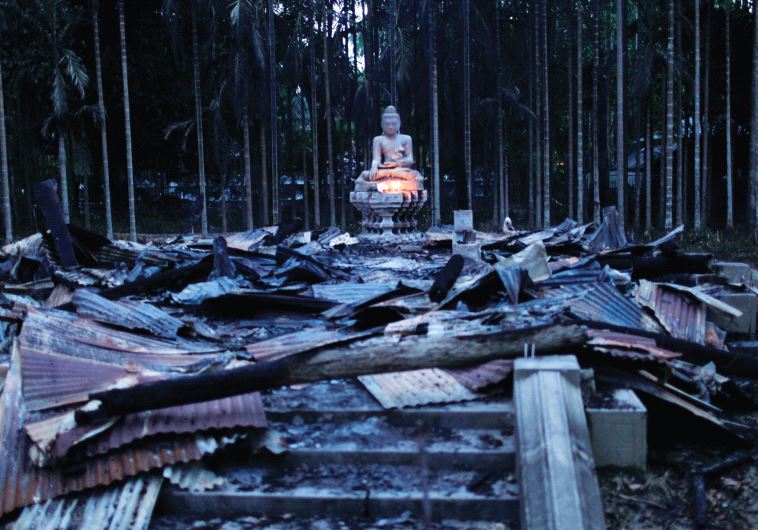 A BUDDHA sculpture sits atop wreckage after an attack against a Buddhist temple in Cox’s Bazar, Bang