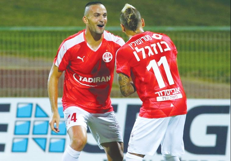 Hapoel Beersheba striker Ben Sahar (left) celebrates with teammate Maor Buzaglo after scoring his se