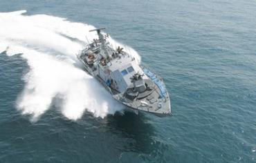 A SUPER DVORA Mark III fast patrol boat races on the Mediterranean Ocean.