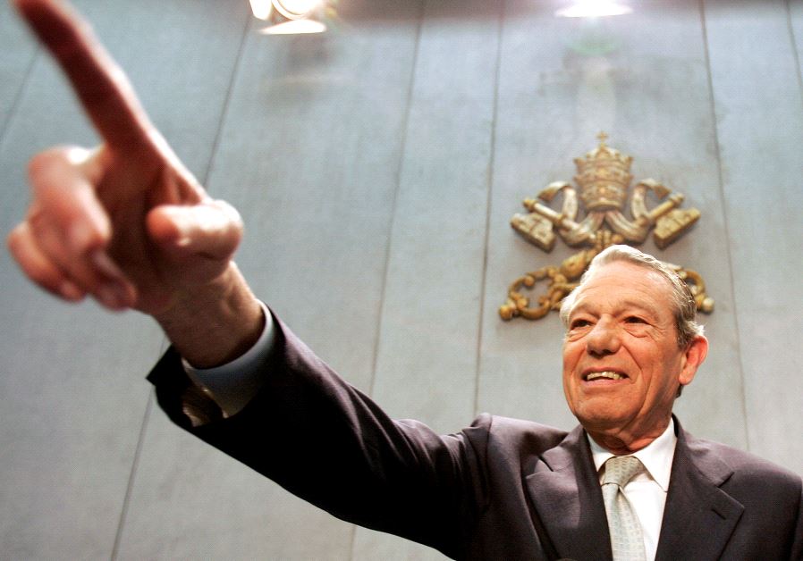 The Pope's official spokesman Joaquin Navarro-Valls gestures during a news conference.