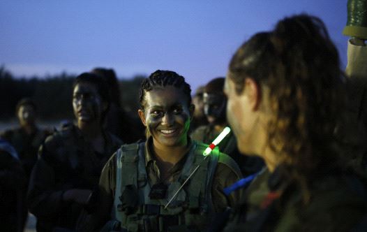 Israeli soldiers of the Caracal battalion take part in a march May 29, 2014.