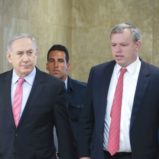 PRIME MINISTER Benjamin Netanyahu is accompanied by PMO Director-General Eli Groner to the weekly go