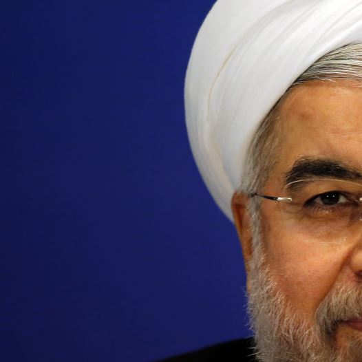 Iran's President Hassan Rouhani attends a news conference in Shanghai