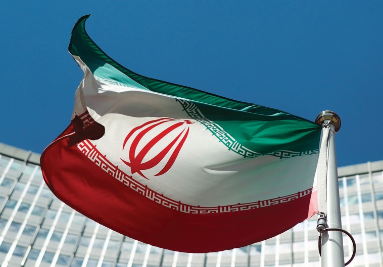 AN IRANIAN flag flutters in the breeze