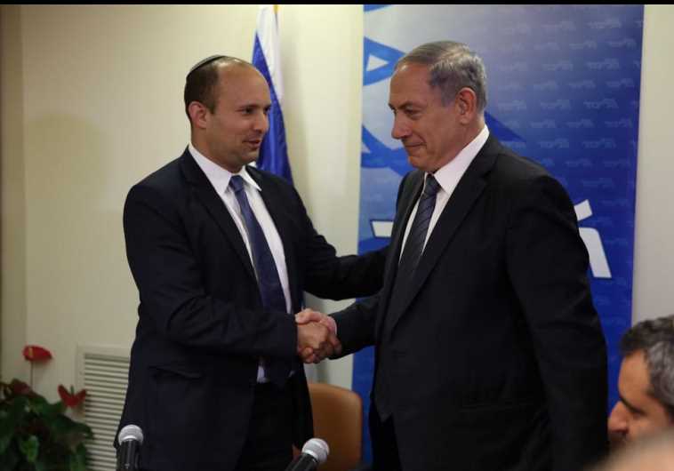Prime Minister Benjamin Netanyahu (R) shakes hands with Bayit Yehudi chief Naftali Bennett