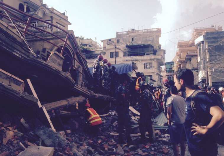 Rescue workers search the rubble in Nepal, May 12, 2015