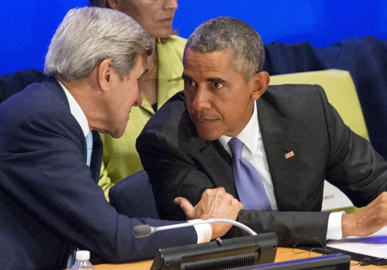 US Secretary of State John Kerry (L) speaks to US President Barack Obama (R) during the Leaders' Sum