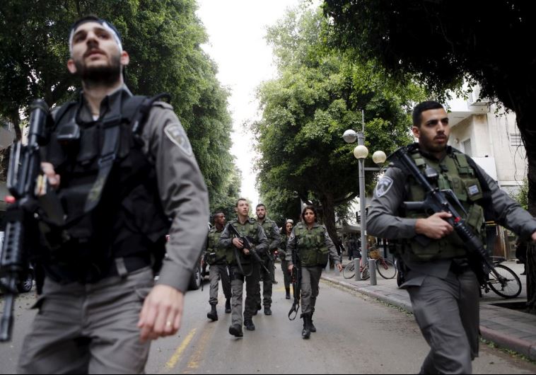 Israeli border police guards secure near the scene of a shooting incident in Tel Aviv
