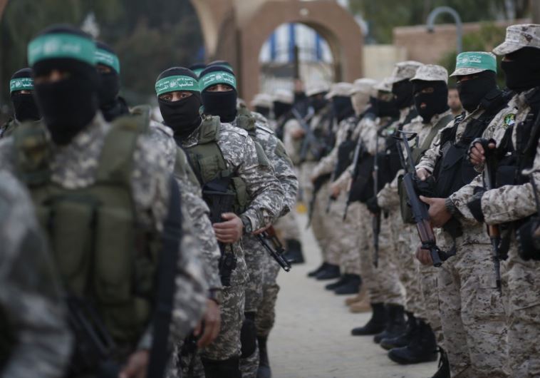 Palestinian Hamas militants take part in a rally in memory of their seven comrades
