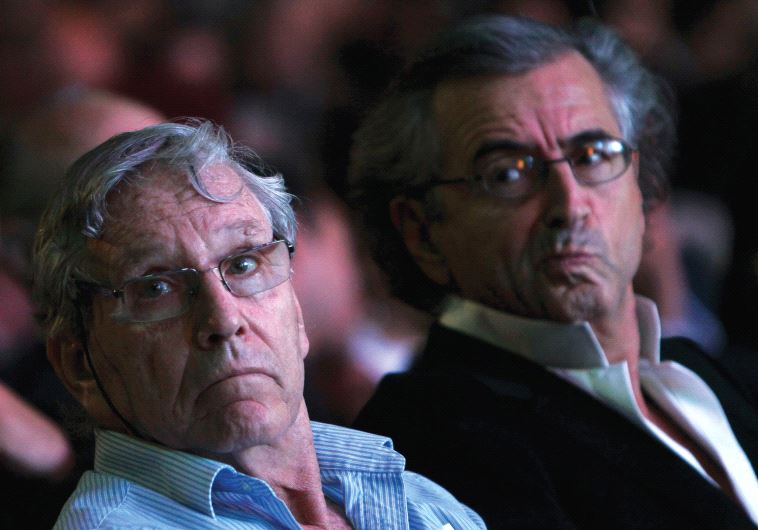 ISRAELI NOVELIST Amos Oz sits next to French philosopher Bernard Henri Levy