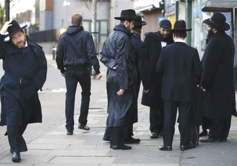 JEWISH MEN share a conversation in Golders Green, London, in January 2015.