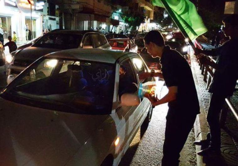 Youth in Tulkarm distributing candies
