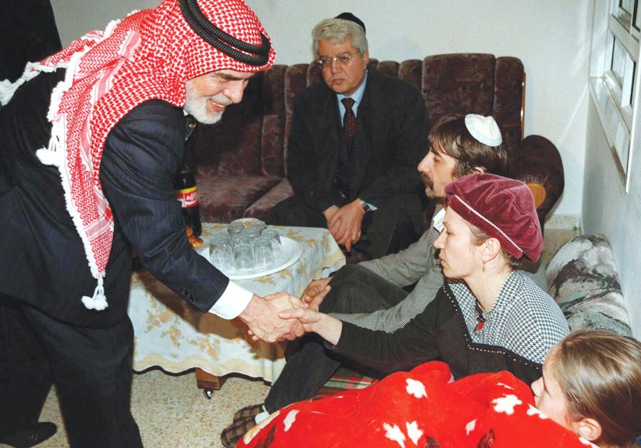 JORDAN’S KING Hussein leans over and shakes hands with Margalit Badayev, the mother of slain Israel