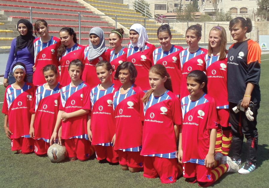 Palestinian girls play soccer to win in the West Bank Middle East