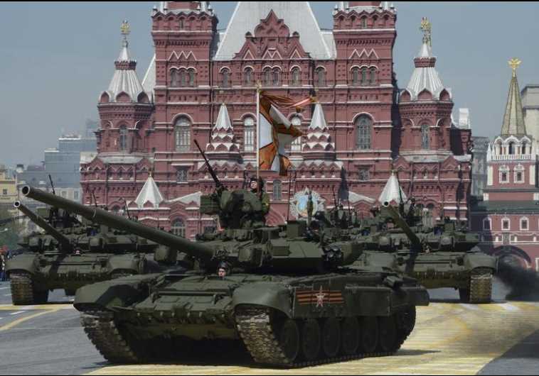 Russian T-90A main battle tanks drive during the Victory Day parade at Red Square in Moscow