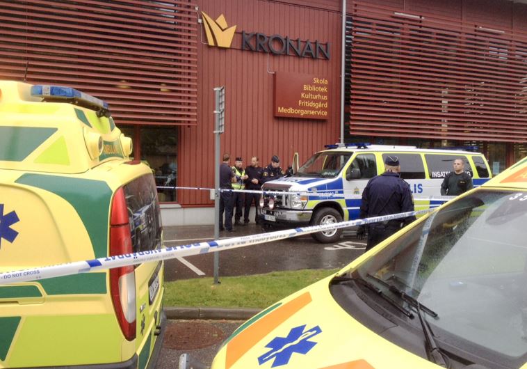 Police cordon off an area after a masked man attacked people with a sword at a school in Trollhattan