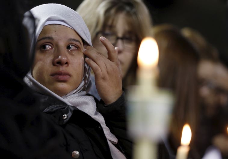 An attendee reflects on the tragedy of Wednesday's attack during a candlelight vigil
