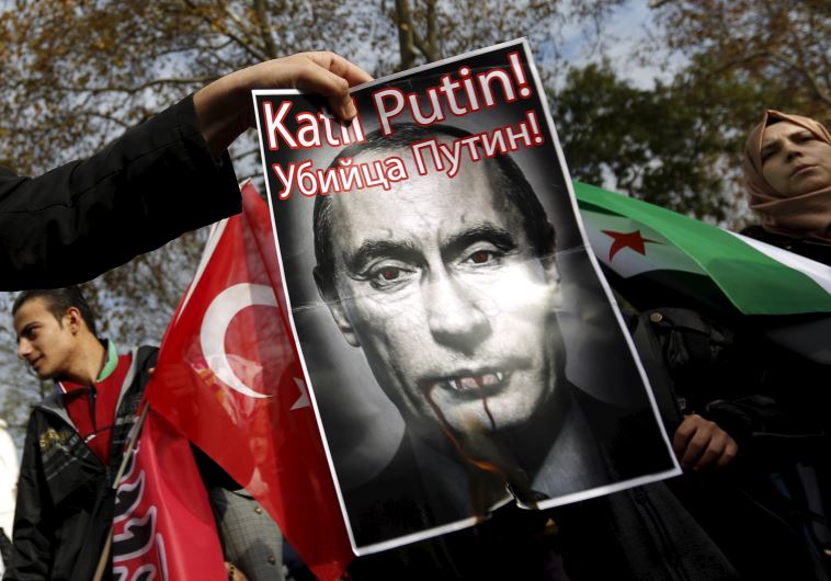 Pro-Islamist demonstrators set fire to a defaced poster of Russia's President Vladimir Putin