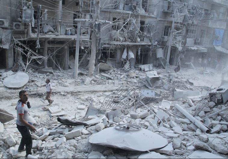 Residents look for survivors at a damaged site in Aleppo