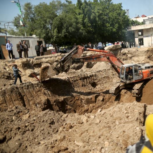 An excavator operates at the site where ancient ruins, which archaeologists say may be part of a Byz